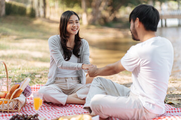 Happy romantic couple in Valentine Day asian couple hold hands for close moment together. happy...