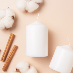 Aroma candles with the aroma of spices. Winter scents. Cinnamon sticks, cotton flowers.
