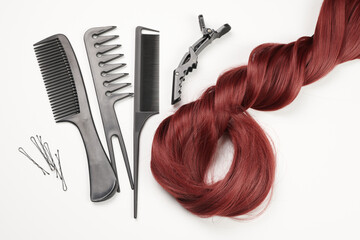 Hairdresser tools close-up isolated on white background. Hair curls and set of combs, clips,...
