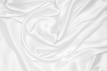 Abstract white fabric texture background. Cloth soft wave. Creases of satin, silk, and cotton.