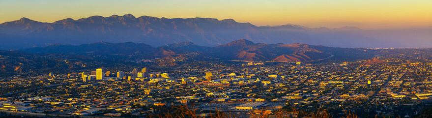 Sunset panorama of downtown Glendale and San Gabriel Mountains in the background viewed from...