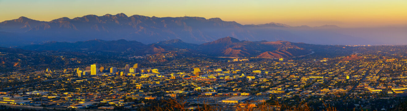 Sunset panorama of downtown Glendale and San Gabriel Mountains in the background viewed from Griffith Park near Los Angeles, California.