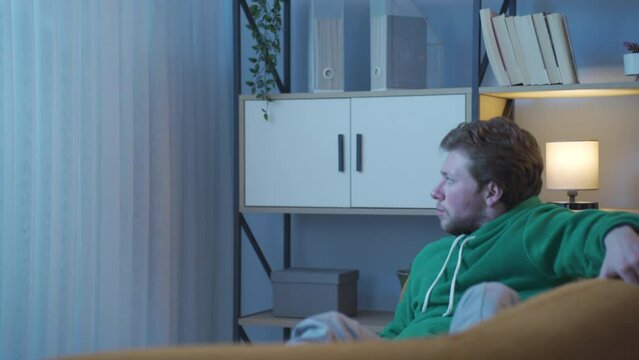 Man hallucinating at home.