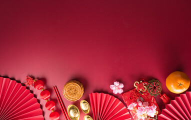 Chinese new year decorations made from red packet, orange and gold ingots or golden lump. Chinese...