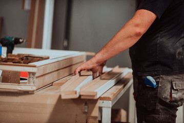 A skilled worker in the woodworking industry adeptly utilizes modern machinery to process and prepare wooden doors for the market, showcasing a seamless blend of traditional craftsmanship and cutting