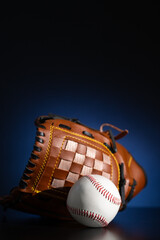 baseball glove and ball. Baseball equipment. Blue background