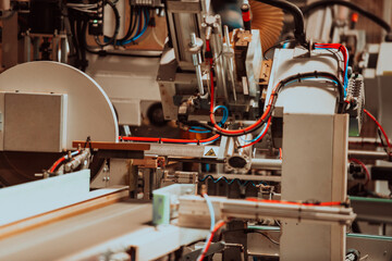 A state-of-the-art CNC machine in a modern wood processing facility showcases the seamless fusion of precision technology and traditional craftsmanship, working harmoniously to produce a diverse array