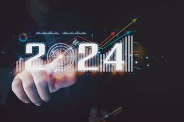 Businessman analyzes business growth plan in 2024, digital marketing strategy, revenue, profit,...