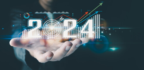 Businessman analyzes business growth plan in 2024, digital marketing strategy, revenue, profit,...