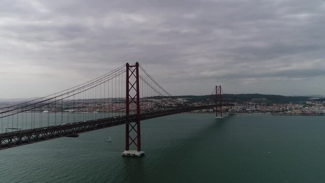 Aerial view of 25th April Bridge in Lisbon, Portugal. Famous landmark on river Tagus. High quality photo
