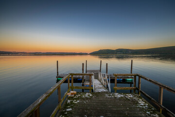 Knysna Lagoon with jetty and fishing boats at sunset in the Garden Route South Africa