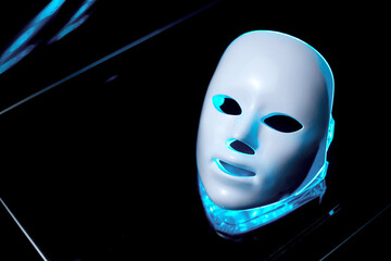 Cosmetic LED mask. Concept of an android face and a virtual reality mask.