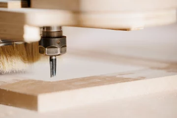 Foto op Plexiglas Close-up cutting wood on CNC milling machine for kitchen furniture wooden on factory © Parilov