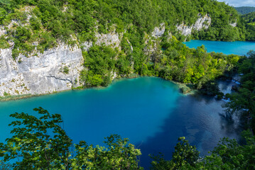 Fototapeta na wymiar Picturesque lakes among forests and mountains. Plitvice Lakes, Croatia.