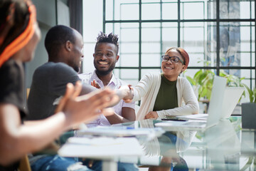 african business people handshake at modern office