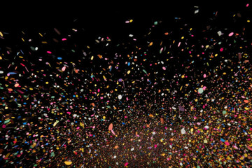 Colorful explosion of confetti. Grainy abstract multicolored texture isolated on black background - obrazy, fototapety, plakaty