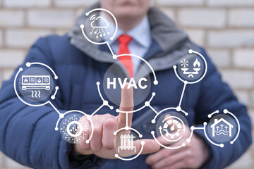 Man using virtual touch screen presses abbreviation: HVAC. HVAC concept of Heating Ventilation Air Conditioning. Industrial and Home Air Conditioning Cooling Systems Repair Service.