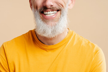 Closeup portrait handsome smiling 50 years old man with stylish gray beard, white teeth wearing...