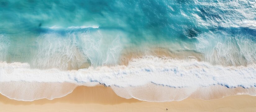 Aerial summer beach view with turquoise water waves and a drone Copy space image Place for adding text or design