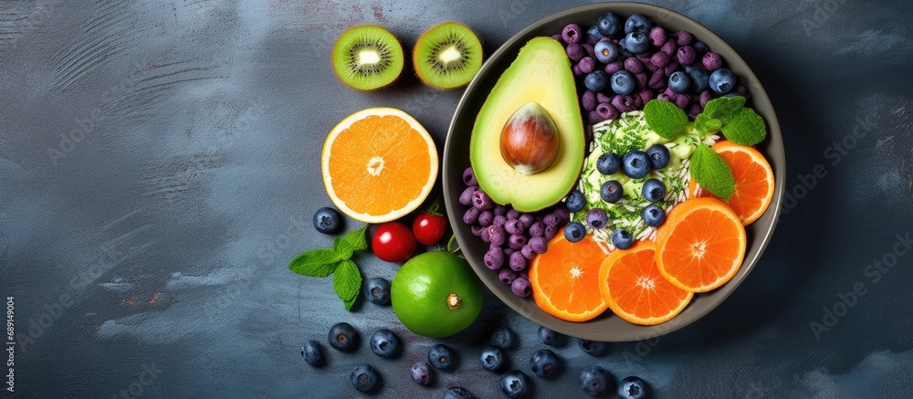 Aufkleber Dietary food bowl with sweet potatoes blueberries avocado cabbage and orange Top view with free space for text Copy space image Place for adding text or design