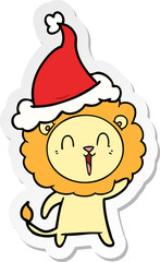 laughing lion hand drawn sticker cartoon of a wearing santa hat