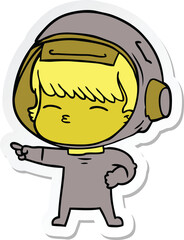 sticker of a cartoon curious astronaut pointing