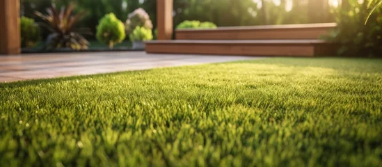 Fotobehang Modern Australian home with wooden edged artificial grass in the front yard Copy space image Place for adding text or design © vxnaghiyev