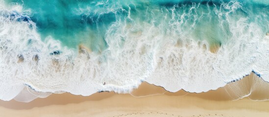 Aerial summer beach view with turquoise water waves and a drone Copy space image Place for adding text or design