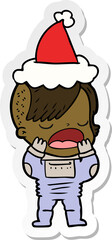 Naklejka premium hand drawn sticker cartoon of a cool hipster girl in space suit wearing santa hat