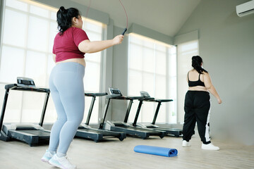 Young woman exercising in the fitness center, exercise concept. Lose weight.