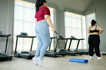 young woman jumping rope to exercise Exercise concept to lose weight.