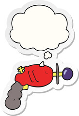 cartoon ray gun with thought bubble as a printed sticker