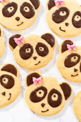 Panda shaped shortbread cookies with chocolate icing