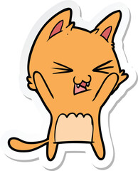 sticker of a cartoon cat hissing