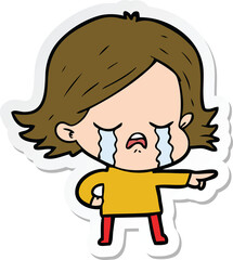 sticker of a cartoon girl crying and pointing