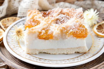 Cheesecake with apricot marmalade and coconut flakes. Recipe for a delicious homemade cake.