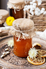 Jars of honey on wooden table.