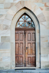 Fototapeta na wymiar The main entrance to the historic Gothic church.