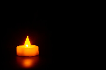 Candle in the dark with copyspace