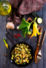 Sliced spiced zucchini with oil, salt and garlic