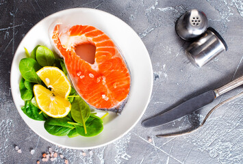 raw salmon steaks and different spices, diet food