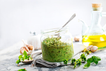 pesto sauce in glass jar, sauce from basil
