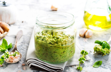 pesto sauce in glass jar, sauce from basil