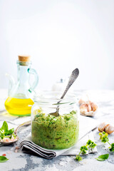 pesto sauce in glass jar, sauce from basil
