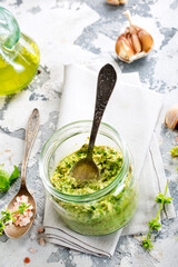 pesto sauce in glass jar, sauce from basil
