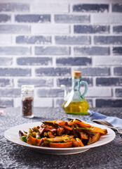 Chopped cooked vegetables on dark background, Traditional ratatouille with zucchini, bell pepper...
