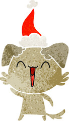 waving little dog hand drawn retro cartoon of a wearing santa hat