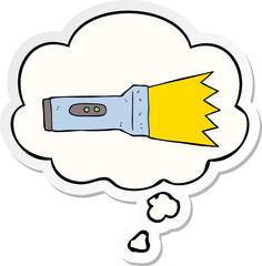 cartoon torch with thought bubble as a printed sticker