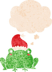 cute cartoon christmas frog with thought bubble in grunge distressed retro textured style
