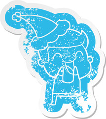 quirky cartoon distressed sticker of a man laughing wearing santa hat